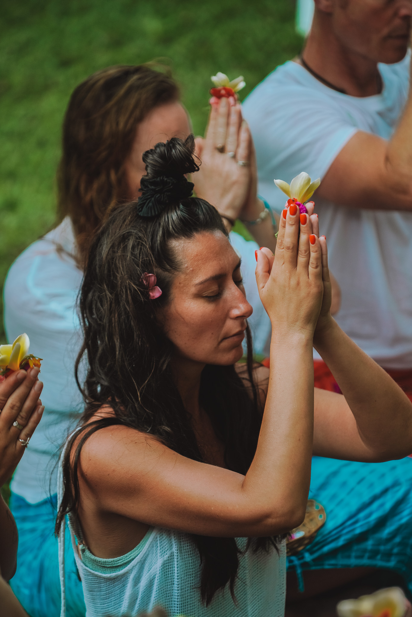Portrait of Alyssa, founder of Frequency First, on the beach in cream linen